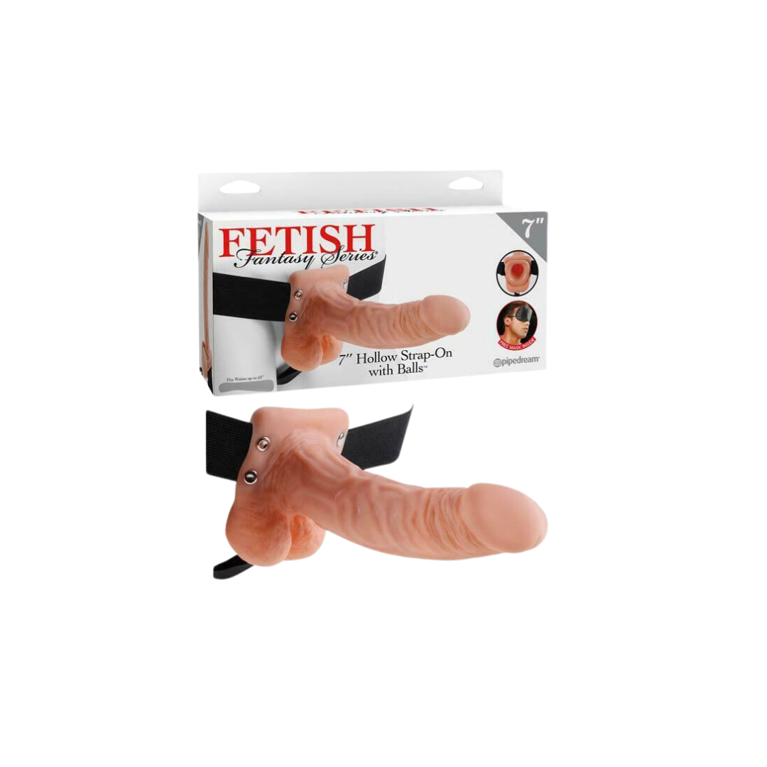 A 7-inch hollow strap-on dildo with balls, attached to an adjustable harness. The product is packaged in a box with the brand name 'Fetish Fantasy' displayed.